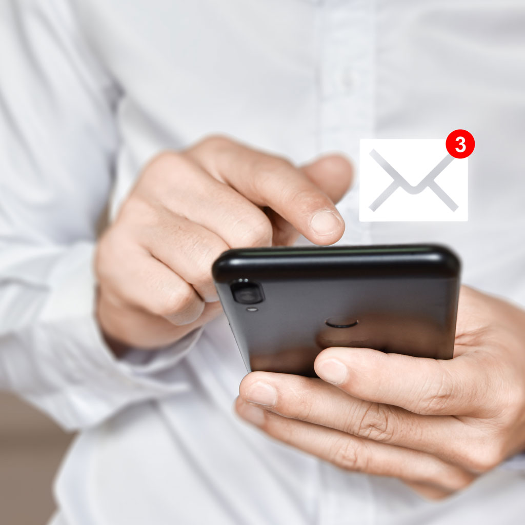 Person using a smartphone with a graphic showing three new email notifications.